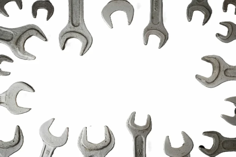 Wrenches arranged in a circle on a light background - productivity tool adoption and knowing when to pick up a new tool