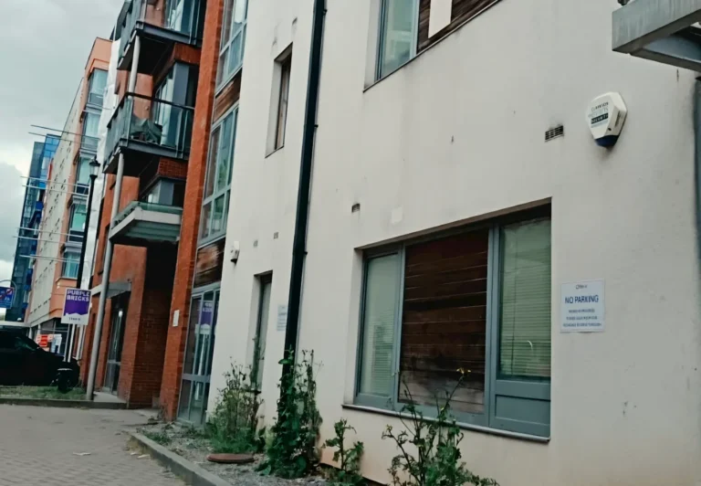 Leasehold apartment block exterior with communal areas - residents management company board for BTL landlords